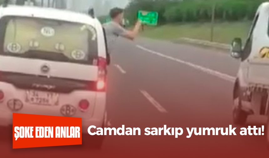 Şoke eden anlar! Camdan sarkıp yumruk attı